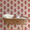 kinderkamer behang met lieverheersbeestje lichtroze rood meisjeskamer